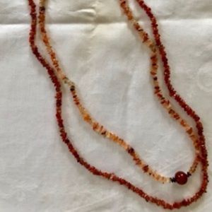 Two strands of beads   Carnelian and agate colors.